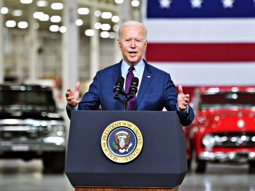 biden touts fair transition to green auto industry as workers pay is cut