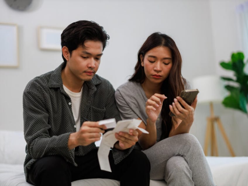 Young Couple Check Receipts