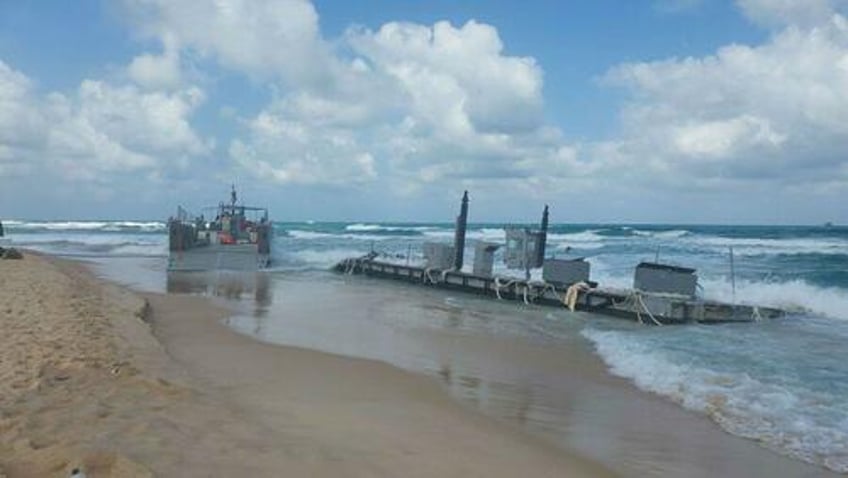 bidens 320m gaza pier has detached drifted onto israeli beach