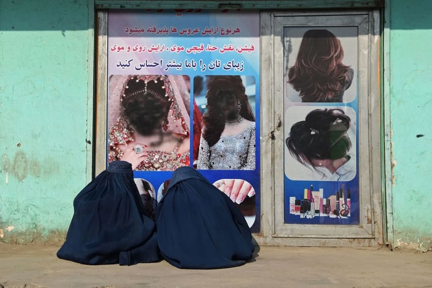 bidens afghanistan taliban use tasers guns against women demanding legal beauty salons