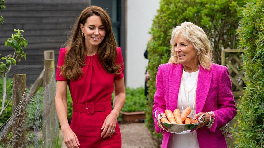 Kate Middleton and Jill Biden walk outside of a classroom