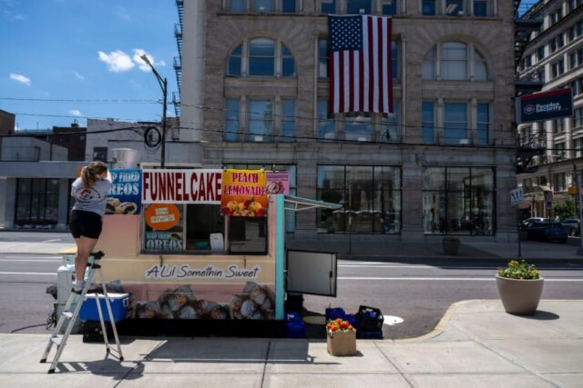 A person sets up a food cart in downtown Scranton, Pennsylvania, Joe Biden's hometown, as