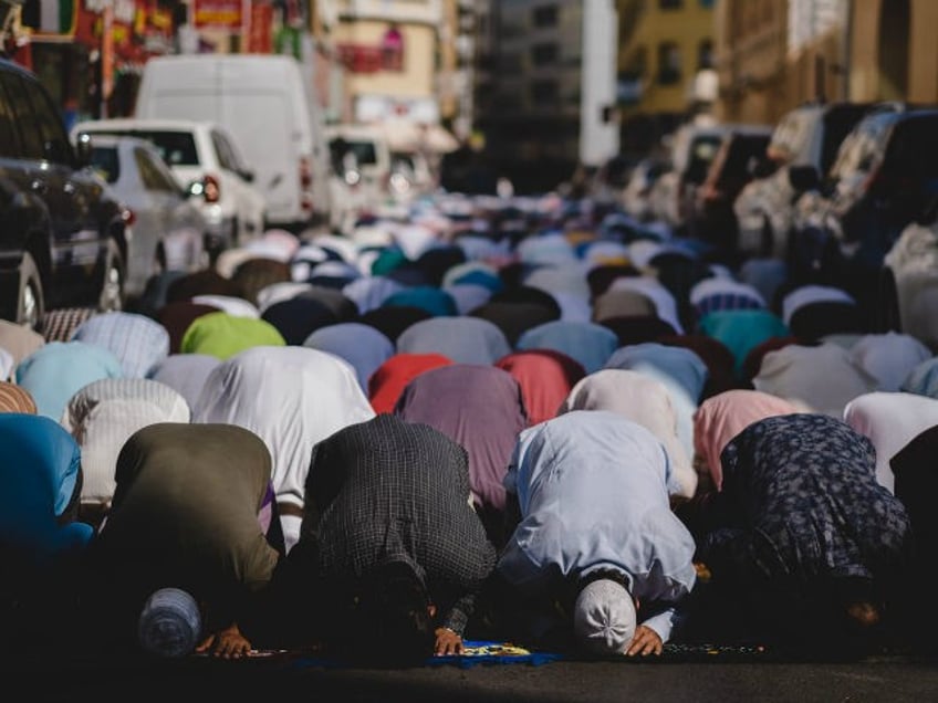 Muslims praying outside Muslim migrants