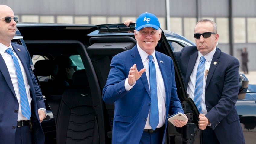 President Joe Biden waves