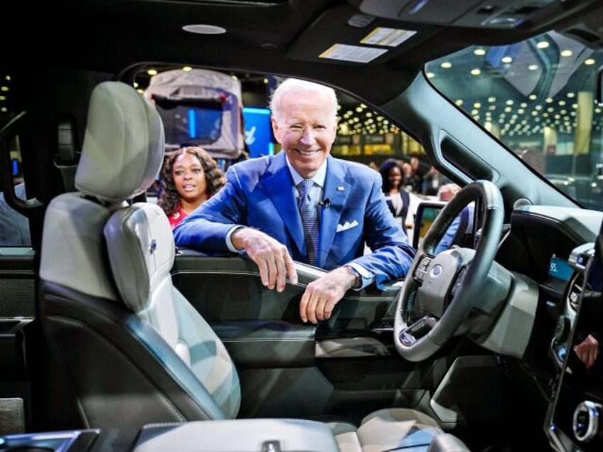 Reportage: President Joe Biden looks at the Ford F-150 Lighting while he tours the North American International Auto Show Wednesday, September 14, 2022, at Huntington Place in Detroit. (HUM Images/Universal Images Group via Getty Images)