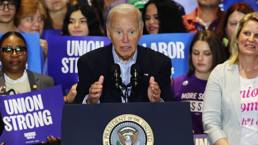 closeup shot, Biden with wide open eyes at podium