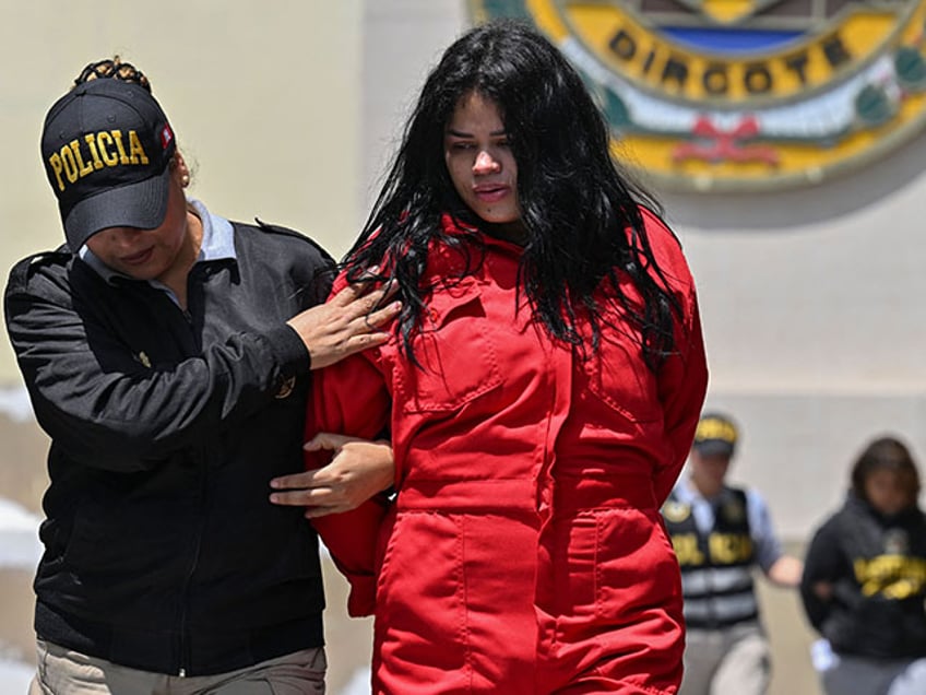 Peruvian police carry out the transfer of one of the members of the Tren de Aragua criminal organization in Lima on October 5, 2023. Peruvian police on Thursday captured the alleged leader and 31 other members of a faction of the Tren de Aragua, the Venezuelan-born criminal organization that sows terror in several South American countries with murders and extortion, according to authorities. The offensive against what is considered the most dangerous gang operating in Peru was carried out in several regions of the country. (Photo by Cris BOURONCLE / AFP) (Photo by CRIS BOURONCLE/AFP via Getty Images)