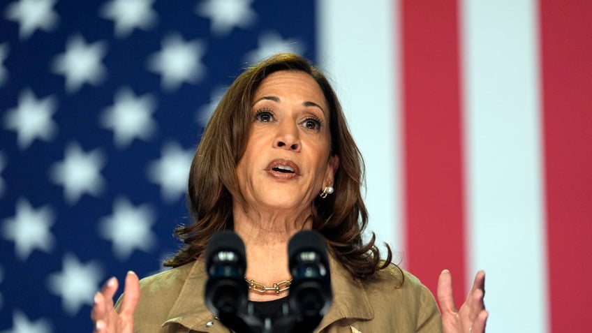 closeup shot of Kamala Harris with US flag behind her