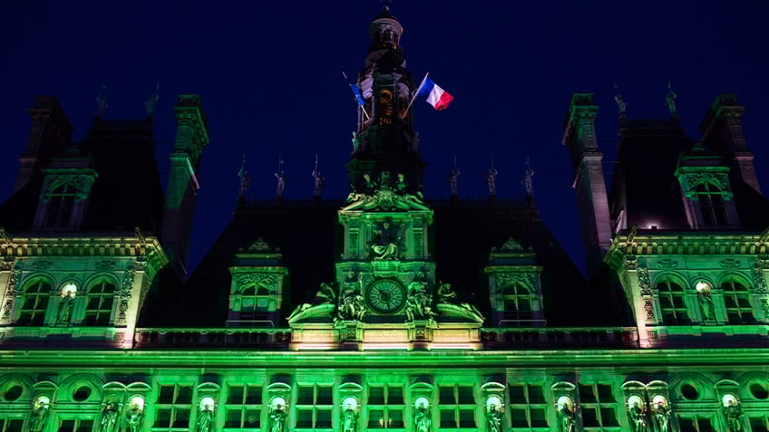Paris City Hall is lit up in green to mark the disapprobation of the French capital and its socialist mayor, Anne Hidalgo, against the decision of then-President Trump to withdraw from the climate agreement made in Paris.
