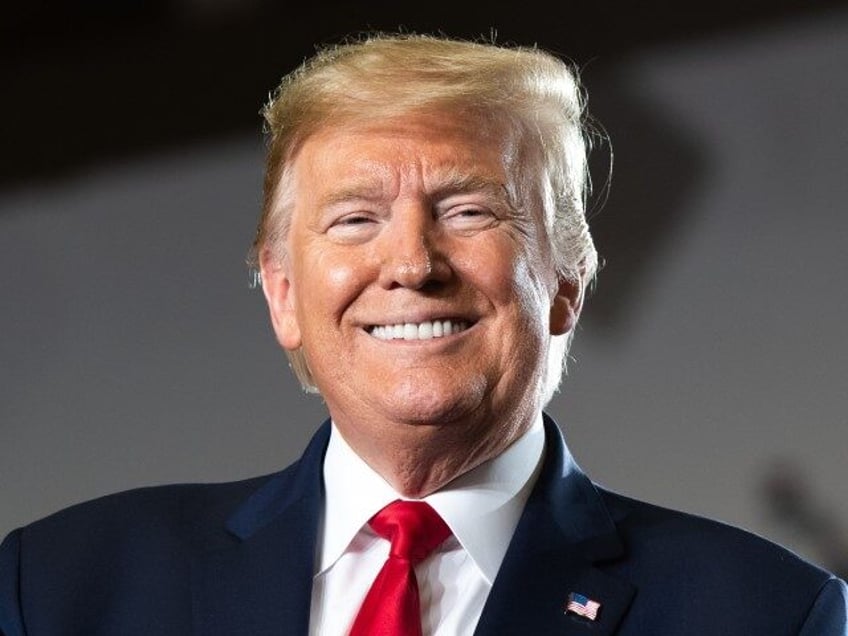 President Donald Trump claps during a "Keep America Great" campaign rally at Wil