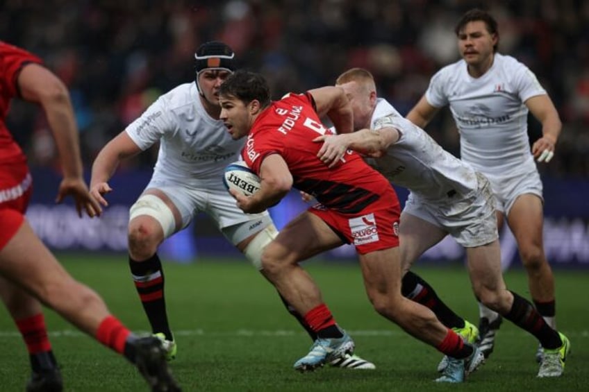 Antoine Dupont (C) scored one of Toulouse's nine tries against Ulster in the Champions Cup