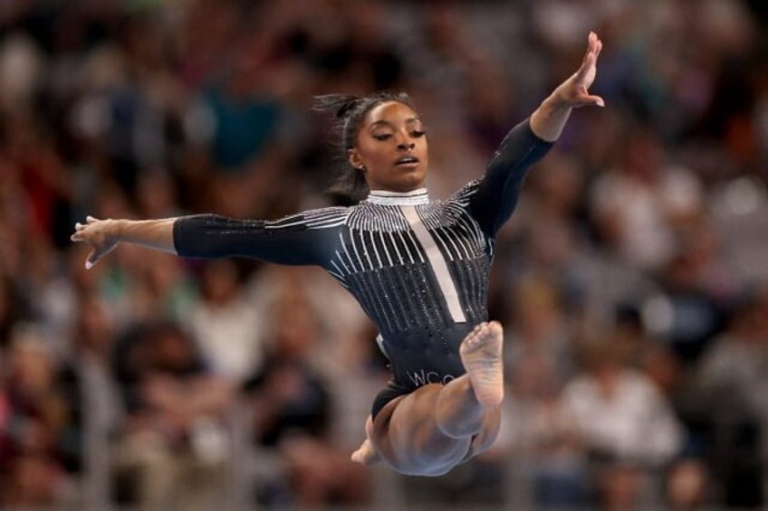 Simone Biles competes in floor exercise at the US Gymnastics championships in Fort Worth,