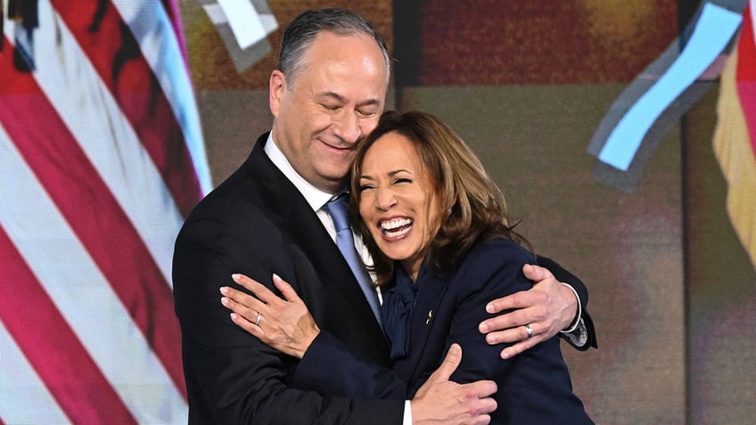 Doug Emhoff embraces Kamala Harris