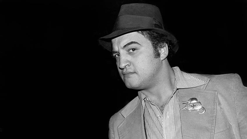 A close-up of John Belushi in a fedora.