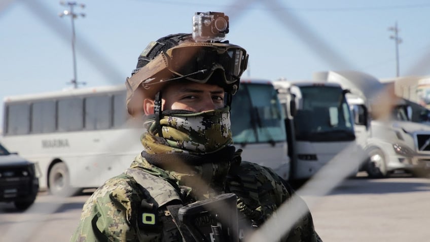 A member of the Mexican Navy looks on as he stands guard as they begin building a temporary shelter on the border in Matamoros, Tamaulipas state, Mexico on January 22, 2025, ahead of US President Donald Trump’s promised deportations.