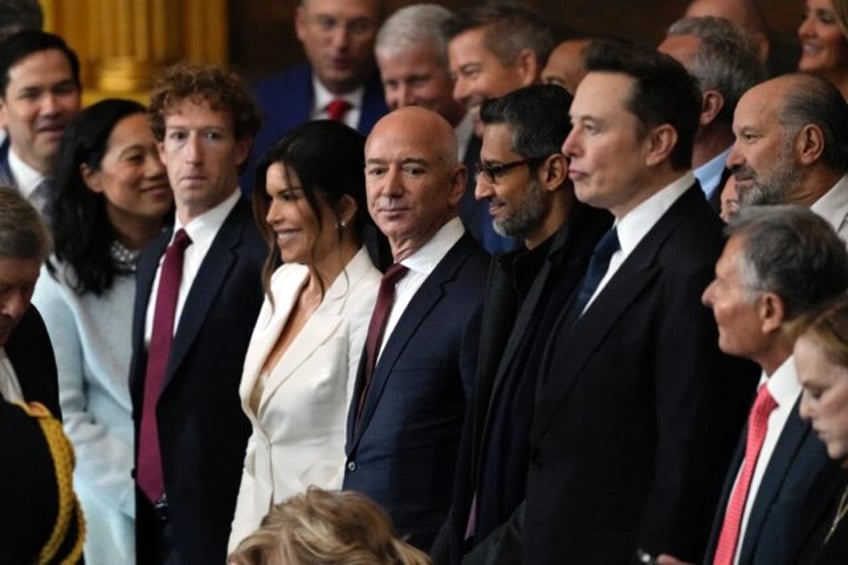 Jeff Bezos (5th from L), along with other US tech billionaires, has appeared increasingly