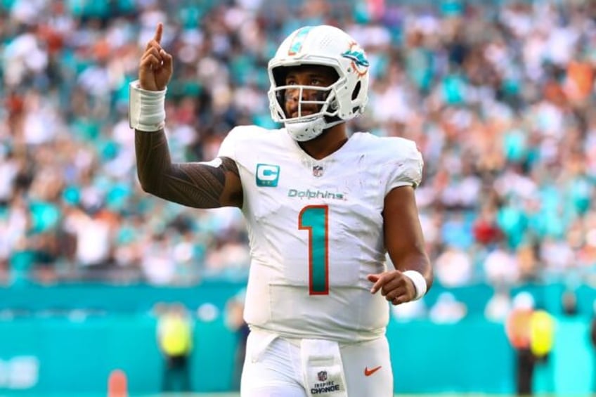 Tua Tagovailoa of the Miami Dolphins celebrates after a touchdown in his club's NFL victory over the New York Jets