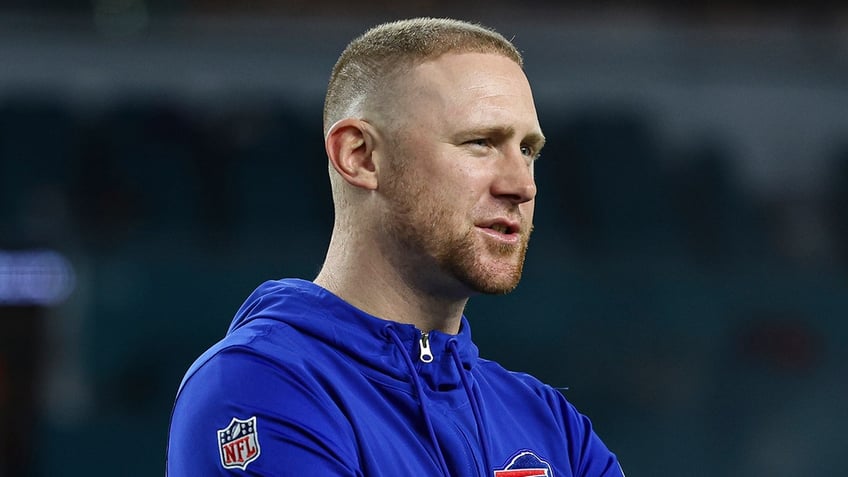 Joe Brady looks on during a game