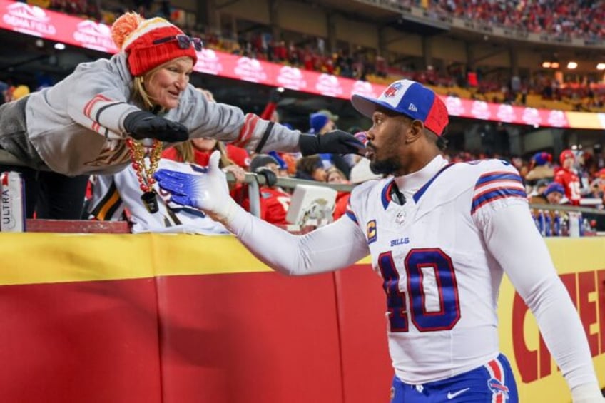 Buffalo Bills linebacker Von Miller greets a fan at an NFL game agaisnt the Kansas City Chiefs