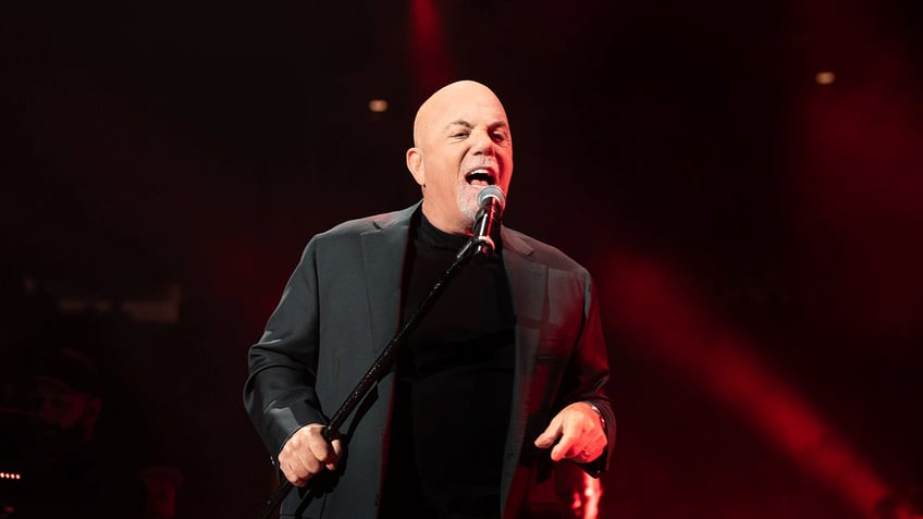 Billy Joel performing at concert