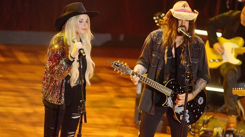 Firerose and Billy Ray Cyrus on stage