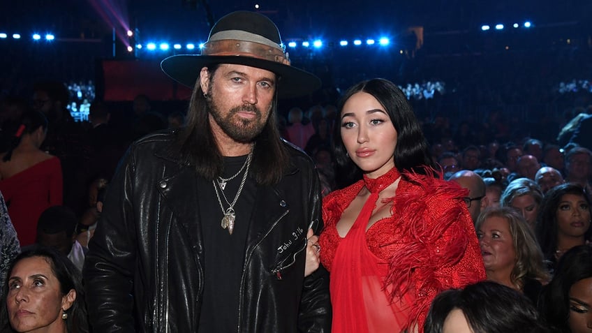 Billy Ray Cyrus and Noah Cyrus posing together