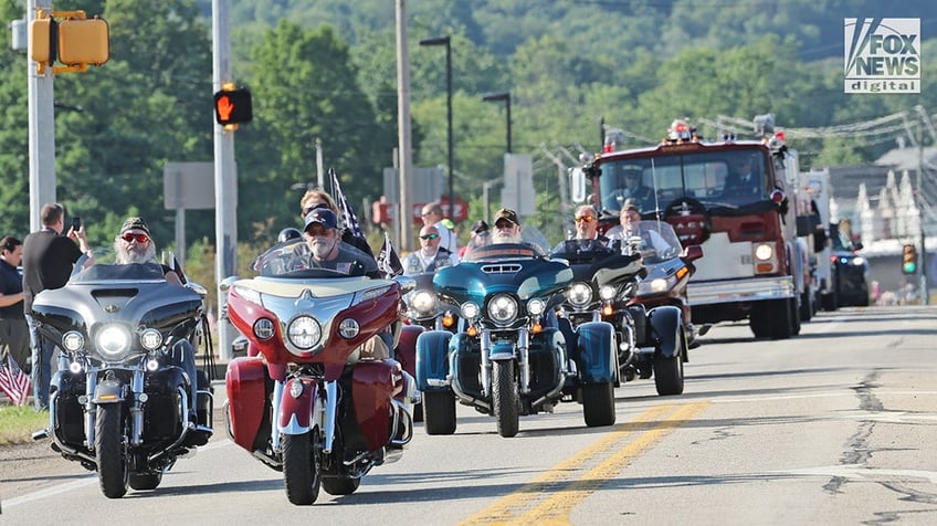 Members of the community mourn the death of Corey Comperatore on the morning of his funeral at Cabot United Methodist Church