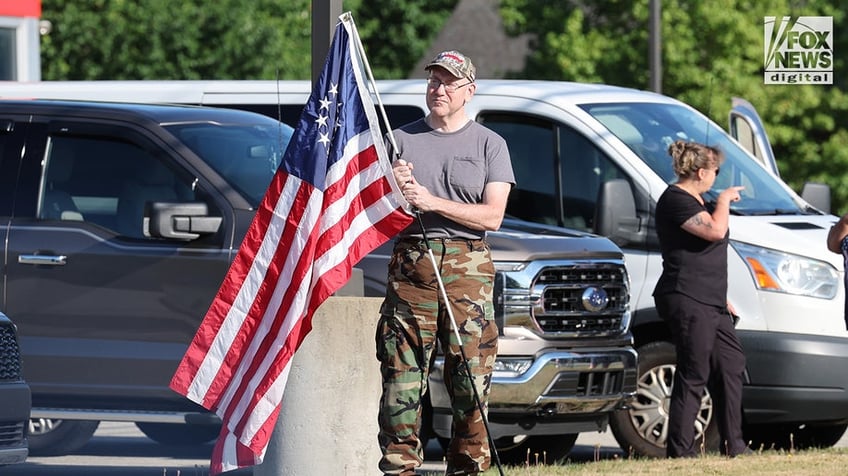 Members of the community mourn the death of Corey Comperatore on the morning of his funeral at Cabot United Methodist Church