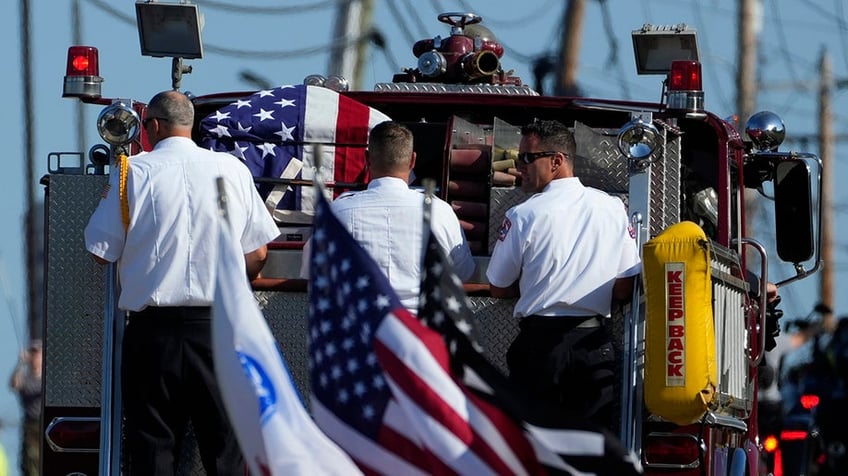 The funeral procession for Corey Comperatore passes