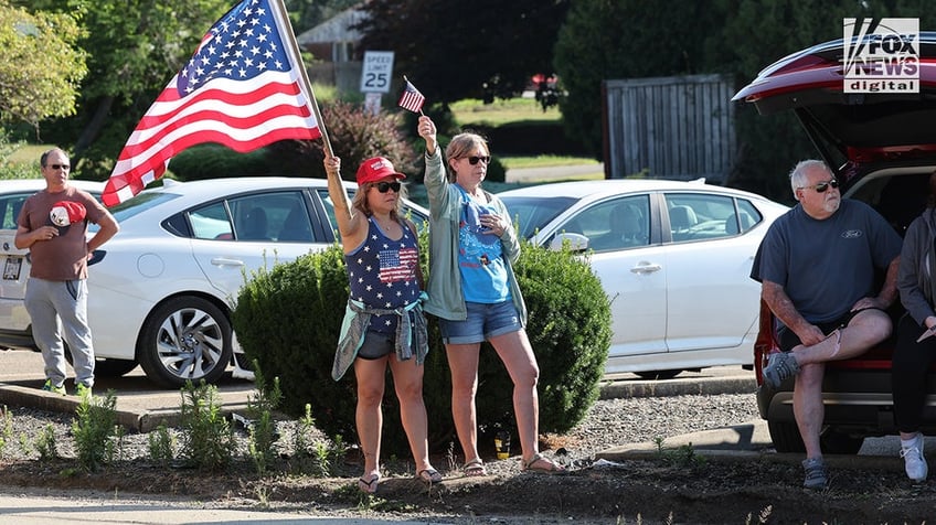 Members of the community mourn the death of Corey Comperatore on the morning of his funeral at Cabot United Methodist Church