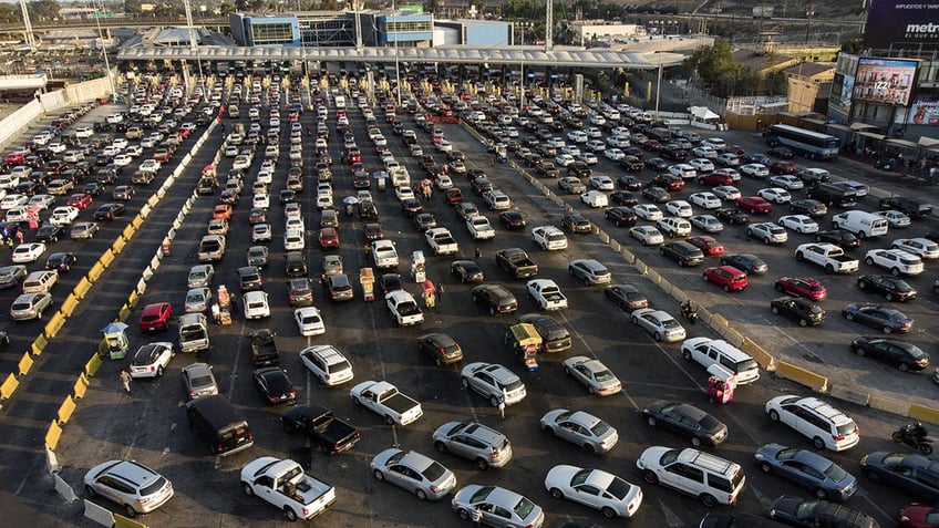 cars lined up at border crossing