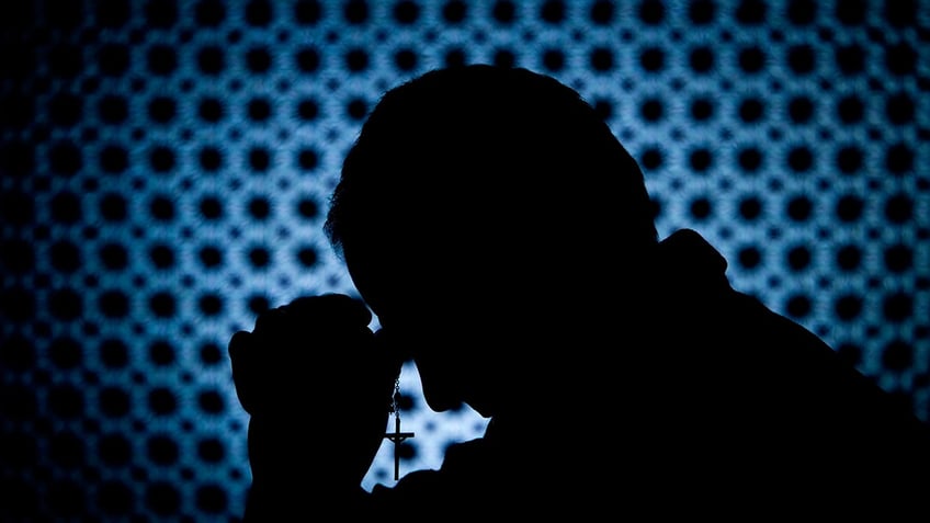 Praying with a cross
