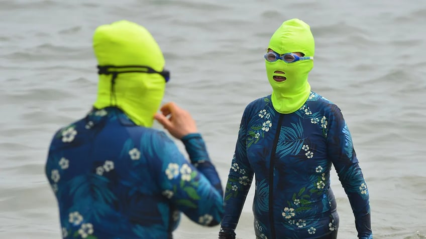 bizarre facekinis fashion craze hits china beaches amid record heat