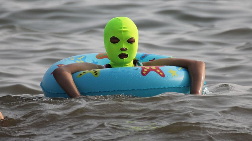 bizarre facekinis fashion craze hits china beaches amid record heat