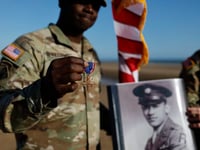 Black D-Day combat medic’s long-denied medal tenderly laid on Omaha Beach where he bled, saved lives