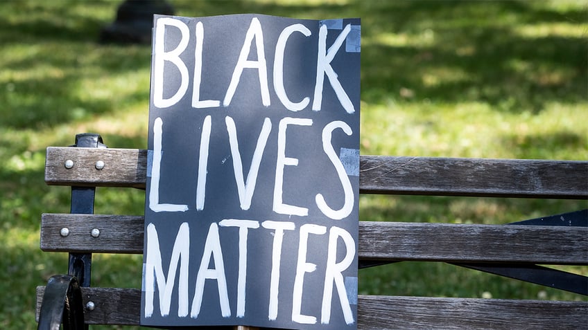 MANHATTAN, NY - JUNE 19: A protesters homemade sign that reads, "Black Lives Matter sits on a park bench next to a hat in Cadman Plaza in Brooklyn. This was part of the Unite NY 2020, Bringing all of New York Together rally and march as protests that happened around the country to celebrate Juneteenth day which marks the end of slavery in the United States. Protesters continue taking to the streets across America and around the world after the killing of George Floyd at the hands of a white police officer Derek Chauvin that was kneeling on his neck during for eight minutes, was caught on video and went viral. During his arrest as Floyd pleaded, "I Cant Breathe". The protest are attempting to give a voice to the need for human rights for African Americans and to stop police brutality against people of color. They are also protesting deep-seated racism in America. Many people were wearing masks and observing social distancing due to the coronavirus pandemic. Photographed in the Manhattan Borough of New York on June 19, 2020, USA. (Photo by Ira L. Black/Corbis via Getty Images)