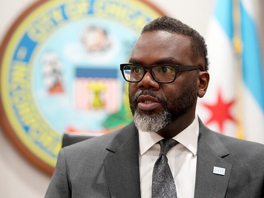 Chicago Mayor Brandon Johnson responds to a question in his City Hall office during an int