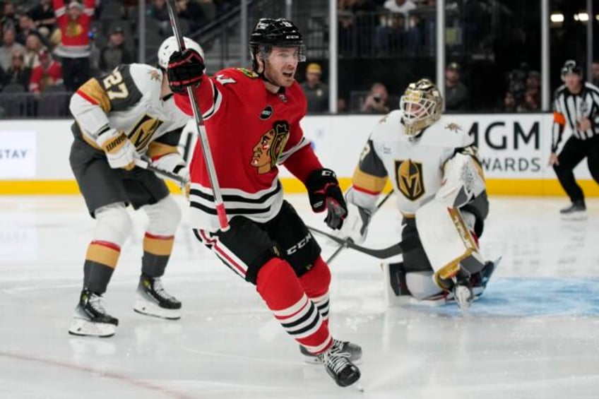 blackhawks hand vegas first loss of season with 4 3 win in overtime