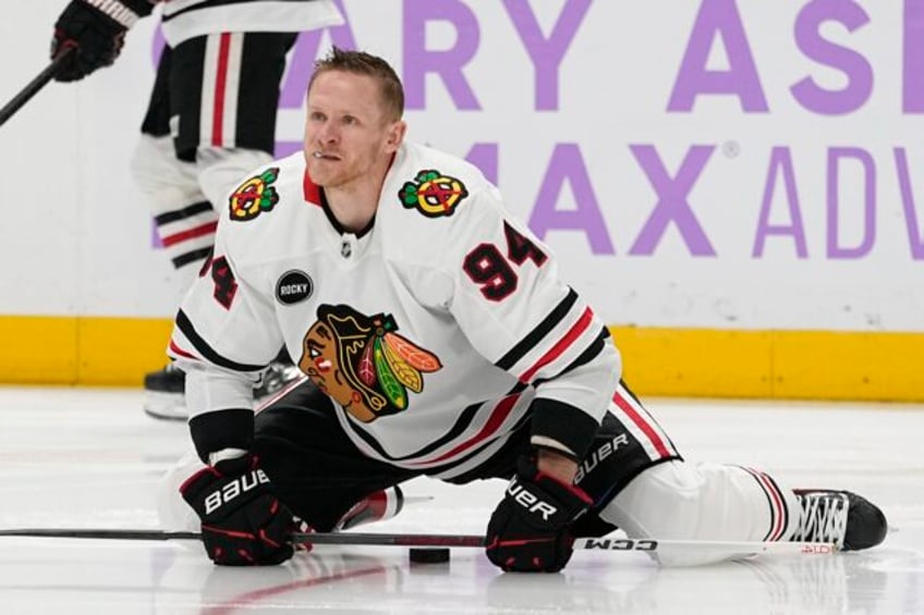 blackhawks say corey perry engaged in unacceptable conduct and move to terminate his contract