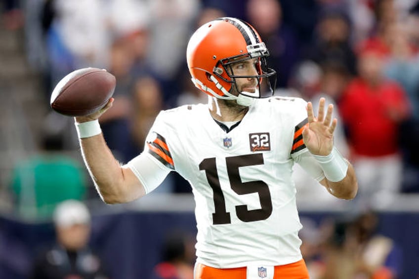 Joe Flacco of the Cleveland Browns throws a pass against the Houston Texans during the first quarter in the AFC Wild Card Playoffs at NRG Stadium on...