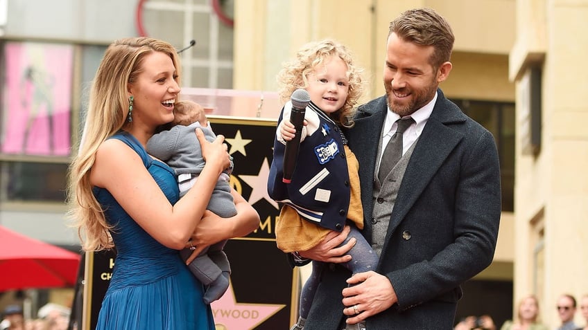 Blake Lively and Ryan Reynolds with two of their children in 2016