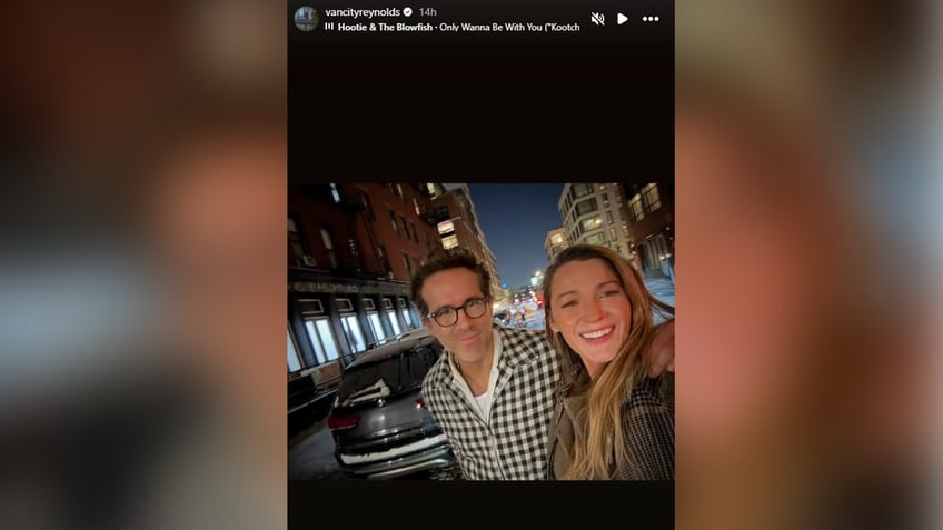 Ryan Reynolds wraps his arm around wife Blake Lively in Instagram selfie.