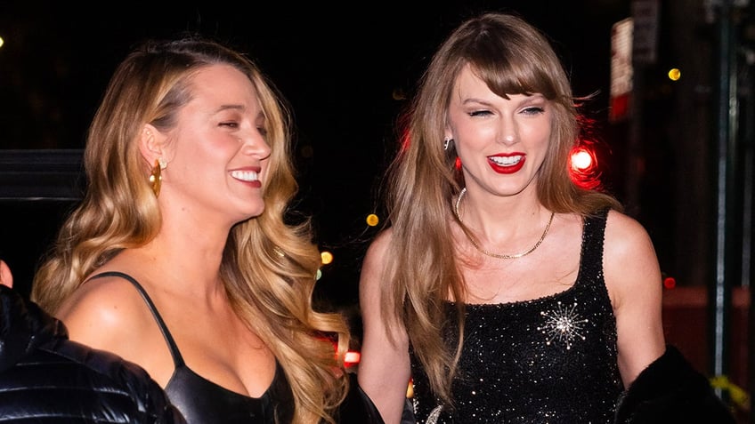 Blake Lively smiles as she walks alongside Taylor Swift while out to dinner