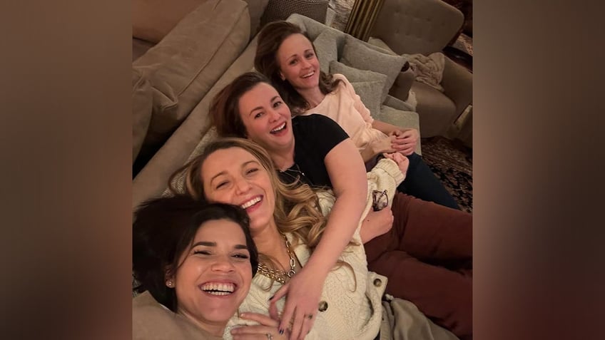 America Ferrera, Blake Lively, Amber Tamblyn and Alexis Bledel smile for a selfie as they huddle on the couch