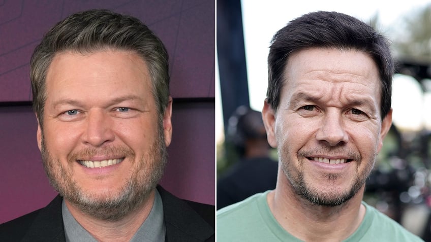 Blake Shelton smiles on the carpet in a black suit split Mark Wahlberg smiles in a green t-shirt