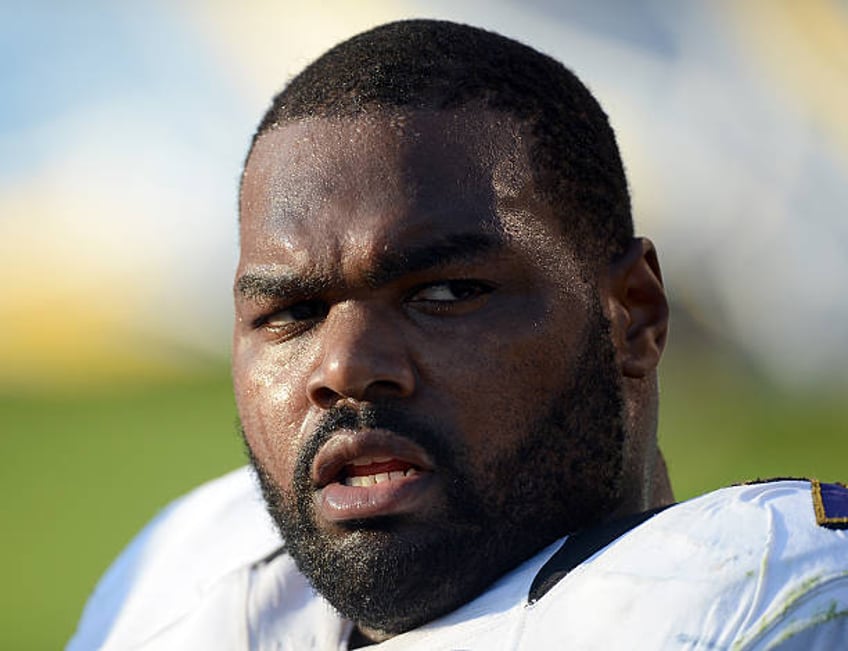 blind side inspiration michael oher sues family claims adoption was a lie