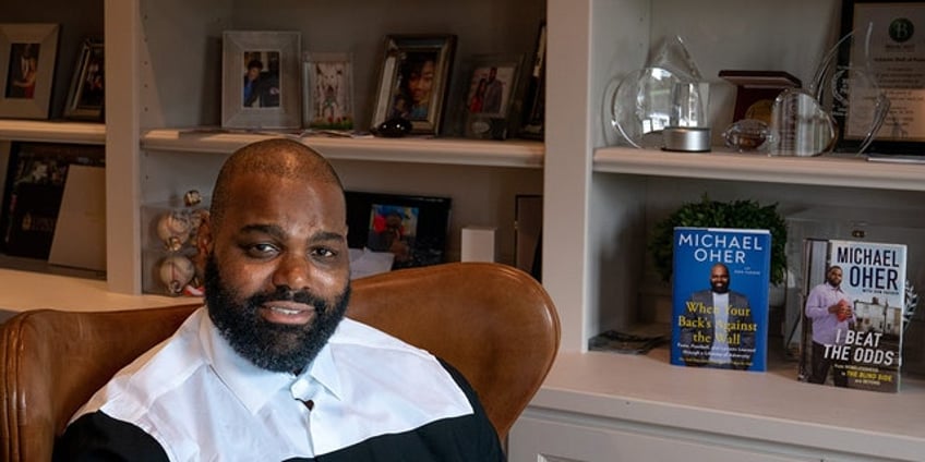 blind side inspiration michael oher wrote about conservatorship in 2011 book we were a family