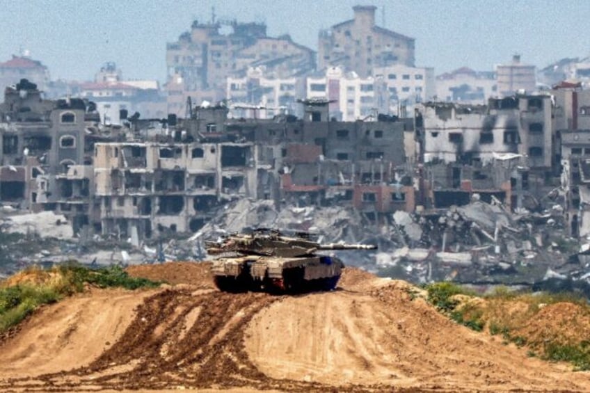 An Israeli army battle tank at a position along the border with Gaza on March 19, 2024