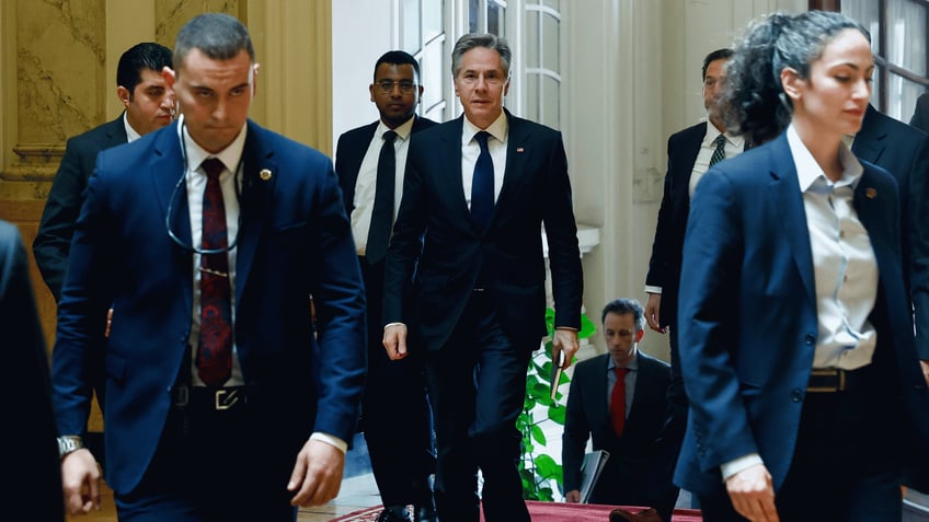 U.S. Secretary of State Antony Blinken, centre, walks to meet with Egyptian Foreign Minister Sameh Shoukry, in Cairo, Egypt, Thursday, March 21, 2024. (Evelyn Hockstein/Pool Photo via AP)