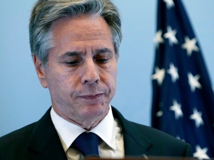 U.S. Secretary of State Antony Blinken lists during a press conference, Thursday Oct. 12,